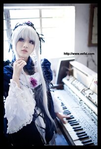Rating: Safe Score: 0 Tags: 1girl 3d black_border blurry depth_of_field dress flower frills instrument letterboxed lips long_sleeves silver_hair solo suigintou wide_sleeves User: admin