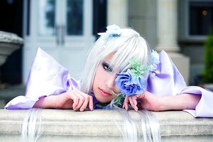 Rating: Safe Score: 0 Tags: 1girl blue_flower blurry blurry_background blurry_foreground book closed_mouth depth_of_field eyelashes fingernails flower hair_ornament indoors lips looking_at_viewer on_stomach open_book solo white_hair User: admin