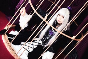 Rating: Safe Score: 0 Tags: 1girl bow_(weapon) dress flower lolita_fashion long_hair long_sleeves red_eyes sitting solo suigintou white_hair User: admin