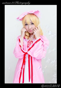 Rating: Safe Score: 0 Tags: 1girl blonde_hair blue_eyes border dress hinaichigo letterboxed lips necklace pink_dress smile solo striped vertical_stripes watermark web_address User: admin