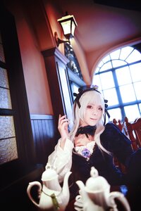 Rating: Safe Score: 0 Tags: 1girl black_dress blurry depth_of_field dress flower gothic_lolita indoors lolita_fashion long_hair long_sleeves looking_at_viewer red_eyes rose solo suigintou teacup white_hair window User: admin
