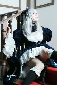 Rating: Safe Score: 0 Tags: 1girl black_legwear boots dress frills gothic_lolita hair_ornament lolita_fashion long_hair sitting solo suigintou sword weapon white_hair User: admin