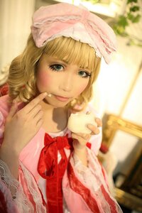 Rating: Safe Score: 0 Tags: 1girl bangs blonde_hair blue_eyes blunt_bangs blurry bow depth_of_field dress eating food food_on_face hat hinaichigo holding_food lips solo User: admin