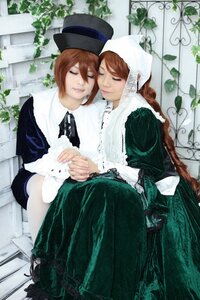 Rating: Safe Score: 0 Tags: 2girls bangs brown_hair closed_eyes dress hat holding_hands long_sleeves multiple_cosplay multiple_girls plant siblings sisters sitting souseiseki suiseiseki tagme top_hat twins User: admin