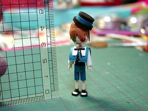 Rating: Safe Score: 0 Tags: 1girl black_footwear blurry depth_of_field doll green_eyes hat long_sleeves orange_hair shirt shoes short_hair shorts solo souseiseki standing User: admin