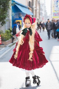 Rating: Safe Score: 0 Tags: 1girl animal black_cat blonde_hair blue_eyes blurry blurry_background blurry_foreground bonnet bow cat depth_of_field dress drill_hair long_hair long_sleeves looking_at_viewer outdoors photo red_dress shinku smile solo standing User: admin