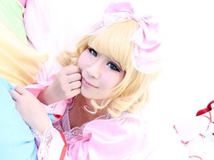 Rating: Safe Score: 0 Tags: 1girl bangs blonde_hair blue_eyes dress drill_hair hinaichigo lips long_hair looking_at_viewer lying ribbon smile solo striped User: admin