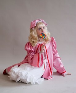 Rating: Safe Score: 0 Tags: 1girl blonde_hair candy dress food grey_background hat hinaichigo lollipop long_hair long_sleeves pink_dress sitting solo User: admin