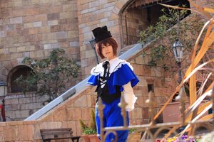 Rating: Safe Score: 0 Tags: 1girl blue_dress blue_headwear blurry brown_eyes brown_hair building capelet day depth_of_field dress flower gloves hat long_sleeves looking_at_viewer outdoors short_hair solo souseiseki standing User: admin