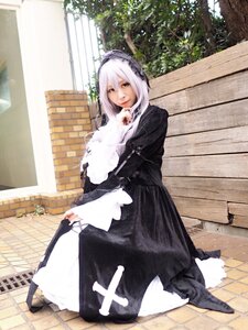 Rating: Safe Score: 0 Tags: 1girl bangs black_dress brick_wall closed_mouth dress hairband long_sleeves looking_at_viewer outdoors pavement red_eyes solo standing suigintou tile_floor tiles User: admin