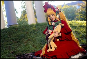 Rating: Safe Score: 0 Tags: 1girl black_border blonde_hair bonnet bow doll doll_joints dress drill_hair flower garden letterboxed long_hair red_dress rose shinku sitting solo very_long_hair User: admin
