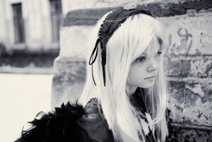 Rating: Safe Score: 0 Tags: 1girl blurry blurry_background blurry_foreground building closed_mouth depth_of_field fur_trim hair_ribbon long_hair monochrome outdoors photo ribbon solo suigintou upper_body User: admin