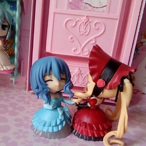 Rating: Safe Score: 0 Tags: blue_eyes blue_hair closed_eyes doll flower hat multiple_girls rose shinku short_hair smile solo tatara_kogasa User: admin
