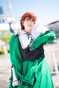 Rating: Safe Score: 0 Tags: 1girl bird blurry blurry_background blurry_foreground brown_eyes brown_hair building day depth_of_field dress green_dress lips long_sleeves looking_at_viewer photo ribbon smile solo standing suiseiseki User: admin