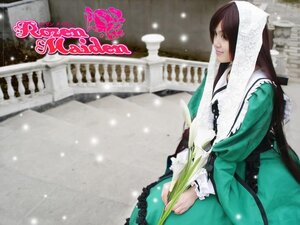Rating: Safe Score: 0 Tags: 1girl brown_hair dress frills green_dress instrument long_hair long_sleeves snow solo suiseiseki User: admin