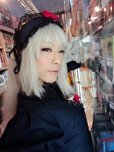 Rating: Safe Score: 0 Tags: 1girl building city hairband lips photo red_eyes solo suigintou white_hair User: admin