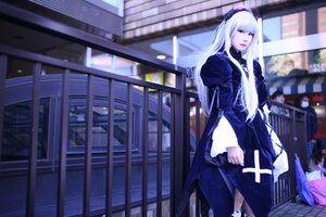 Rating: Safe Score: 0 Tags: 1girl apron black_dress blurry blurry_background blurry_foreground depth_of_field dress frills indoors long_hair long_sleeves maid photo_background solo standing suigintou white_hair User: admin