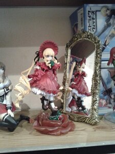 Rating: Safe Score: 0 Tags: 1girl blonde_hair blurry blurry_foreground bow depth_of_field doll dress drill_hair figure hat long_hair long_sleeves photo photo_background red_dress shinku shoes sitting solo standing User: admin