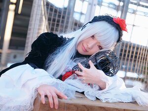 Rating: Safe Score: 0 Tags: 1girl bangs blurry blurry_background depth_of_field flower hair_ornament hairband lips lolita_fashion long_sleeves looking_at_viewer red_eyes solo suigintou white_hair User: admin