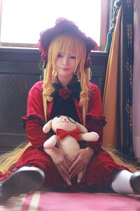 Rating: Safe Score: 0 Tags: 1girl bangs blonde_hair blue_eyes bonnet curtains dog dress flower lips long_hair red_dress rose shinku sitting solo stuffed_animal User: admin