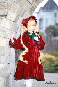 Rating: Safe Score: 0 Tags: 1girl blonde_hair blue_eyes blurry blurry_background bonnet bow building depth_of_field dress drill_hair frills long_hair long_sleeves outdoors outstretched_arm photo red_dress ribbon shinku signature solo standing User: admin