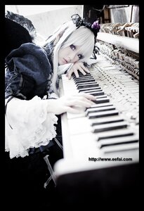Rating: Safe Score: 0 Tags: 1girl blurry crown depth_of_field dress feathers frills letterboxed lips long_hair nail_polish solo suigintou white_hair wings User: admin