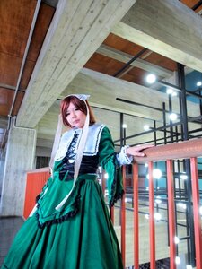 Rating: Safe Score: 0 Tags: 1girl brown_hair building closed_eyes dress green_dress long_sleeves snow solo standing suiseiseki User: admin