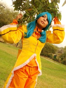 Rating: Safe Score: 0 Tags: 1girl blue_hair grass kanaria lips long_hair long_sleeves lying orange_bodysuit plant solo tree User: admin