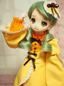 Rating: Safe Score: 0 Tags: 1girl doll dress green_eyes green_hair hat kanaria mini_hat mini_top_hat solo User: admin