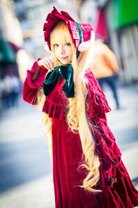 Rating: Safe Score: 0 Tags: 1girl blonde_hair blue_eyes blurry blurry_background blurry_foreground bonnet depth_of_field dress long_hair looking_at_viewer photo red_dress shinku solo standing very_long_hair User: admin