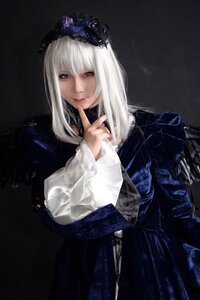 Rating: Safe Score: 0 Tags: 1girl bangs closed_mouth dress finger_to_mouth index_finger_raised long_hair long_sleeves looking_at_viewer red_eyes solo suigintou white_hair User: admin