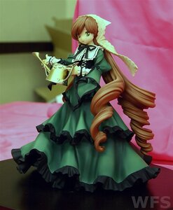 Rating: Safe Score: 0 Tags: 1girl blonde_hair brown_hair doll dress drill_hair frills green_dress green_eyes long_hair long_sleeves solo standing suiseiseki twin_drills very_long_hair watering_can User: admin