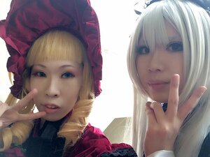 Rating: Safe Score: 0 Tags: 2girls 91076 bangs blonde_hair blue_eyes drill_hair hat lips long_hair looking_at_viewer multiple_cosplay multiple_girls realistic shinku smile striped tagme v User: admin