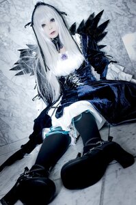Rating: Safe Score: 0 Tags: 1girl black_legwear boots dress frills gothic_lolita hairband lolita_fashion long_hair ribbon sitting solo suigintou thighhighs weapon white_hair User: admin