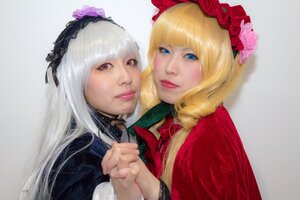 Rating: Safe Score: 0 Tags: 2girls bangs blonde_hair blue_eyes blunt_bangs bow closed_mouth drill_hair eyelashes flower grey_background hairband holding_hands lips long_hair looking_at_viewer multiple_cosplay multiple_girls realistic red_eyes rose shinku smile suigintou tagme User: admin