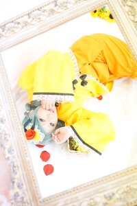 Rating: Safe Score: 0 Tags: 1girl blurry depth_of_field dress flower frills hair_ornament kanaria long_sleeves solo yellow_dress User: admin