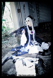 Rating: Safe Score: 0 Tags: 1girl bird black_border black_feathers crow dress feathers frills letterboxed long_sleeves silver_hair sitting solo suigintou wings User: admin