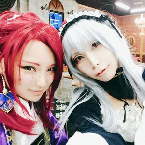 Rating: Safe Score: 0 Tags: 2girls black_eyes closed_mouth lips long_hair looking_at_viewer multiple_girls musical_note red_hair smile solo suigintou white_hair User: admin
