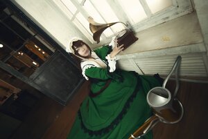 Rating: Safe Score: 0 Tags: 1girl apron book brown_hair dress frills green_dress indoors long_sleeves looking_at_viewer sitting solo suiseiseki User: admin