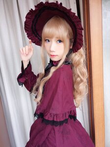 Rating: Safe Score: 0 Tags: 1girl bangs blonde_hair blue_eyes bonnet choker closed_mouth curtains dress frills lips long_hair long_sleeves looking_at_viewer photo red_dress shinku solo User: admin