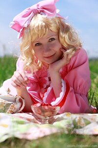 Rating: Safe Score: 0 Tags: 1girl artist_name blonde_hair blue_eyes blurry blurry_foreground bow day depth_of_field dress flower food frills hair_bow hinaichigo looking_at_viewer nose pink_bow pink_dress realistic sky smile solo watermark User: admin
