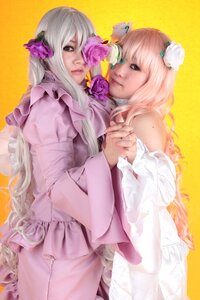 Rating: Safe Score: 0 Tags: 2girls 91076 blue_eyes dress flower frills hair_ornament holding_hands long_hair multiple_cosplay multiple_girls pink_hair tagme User: admin