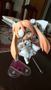 Rating: Safe Score: 0 Tags: 1girl doll dress flower hair_flower kirakishou pink_hair rose solo veil white_flower white_rose User: admin