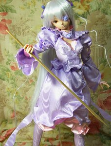 Rating: Safe Score: 0 Tags: 1girl barasuishou doll dress eyepatch flower frills holding long_sleeves rose solo standing weapon yellow_eyes User: admin