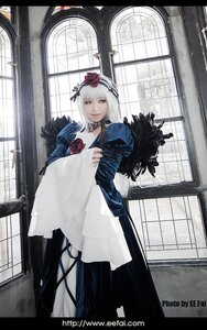 Rating: Safe Score: 0 Tags: 1girl bird dress feathers flower hair_ornament indoors long_hair looking_at_viewer solo standing suigintou watermark window User: admin