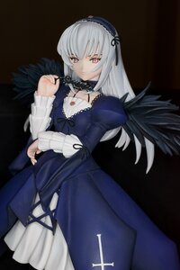 Rating: Safe Score: 0 Tags: 1girl black_background black_wings cross cross-laced_clothes doll dress feathers flower frills hairband juliet_sleeves long_hair long_sleeves looking_at_viewer pink_eyes puffy_sleeves ribbon rose silver_hair simple_background solo suigintou wings User: admin