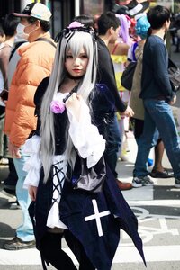 Rating: Safe Score: 0 Tags: 1girl 6+boys black_hair blurry depth_of_field dress hat jeans long_hair long_sleeves looking_at_viewer multiple_boys pants photo solo standing suigintou User: admin