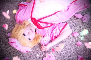Rating: Safe Score: 0 Tags: 1girl blonde_hair blue_eyes cherry_blossoms dress flower hat hinaichigo lips looking_at_viewer mob_cap petals pink_dress ribbon short_hair smile solo User: admin