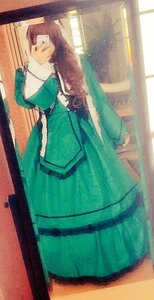 Rating: Safe Score: 0 Tags: 1girl brown_hair dress green_dress indoors long_hair long_sleeves solo standing suiseiseki window User: admin