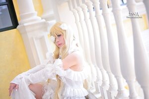 Rating: Safe Score: 0 Tags: 1girl bare_shoulders blonde_hair dress frills indoors kirakishou lips long_hair signature solo veil wedding_dress white_dress window User: admin